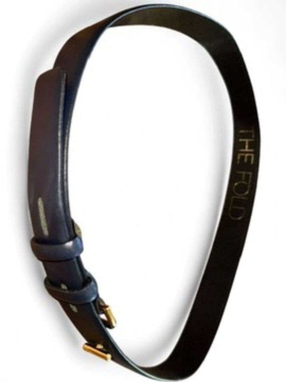 The Fold London navy leather belt with unique T-shaped gold buckle